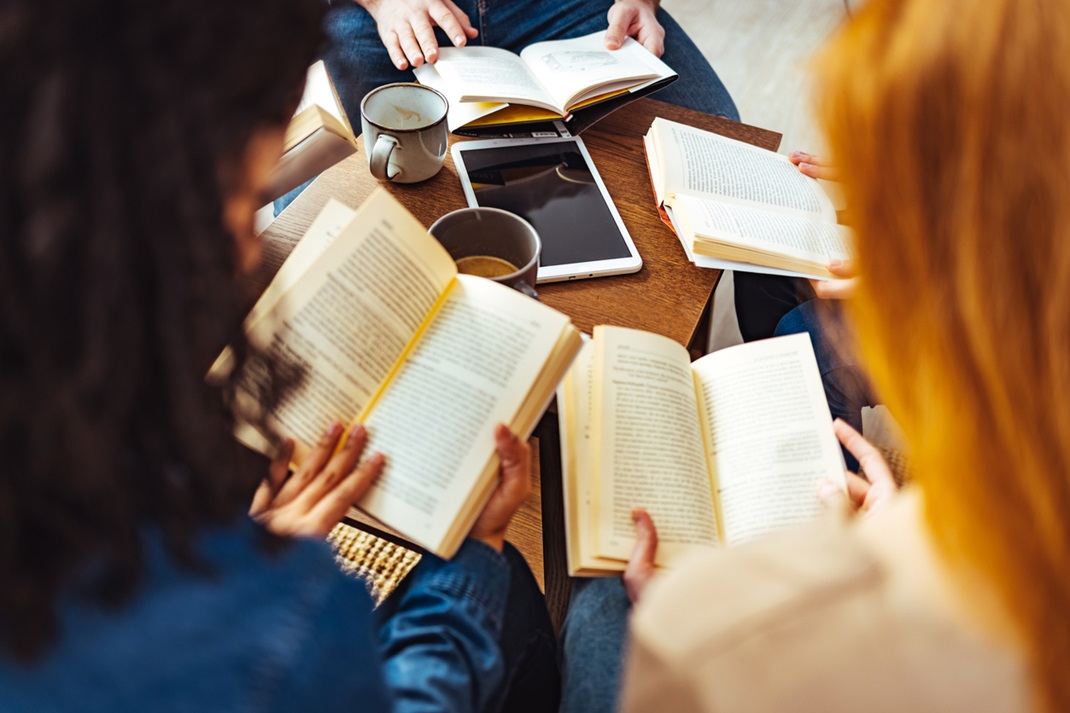 group of adults reading together