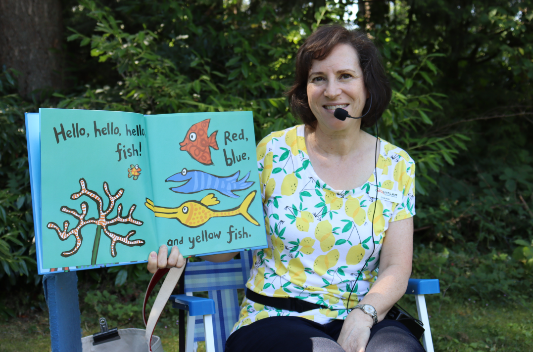 woman holding picture book